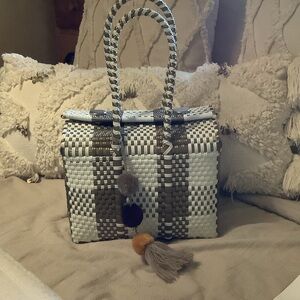 Elegant Checkered Tote with Pom-Pom Charms Un Pueblo